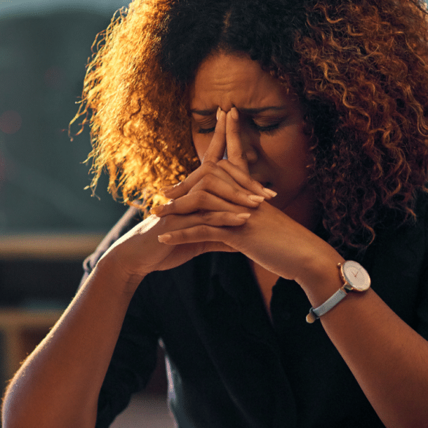 Why teams don't perform: a professional at a desk looking quietly drained